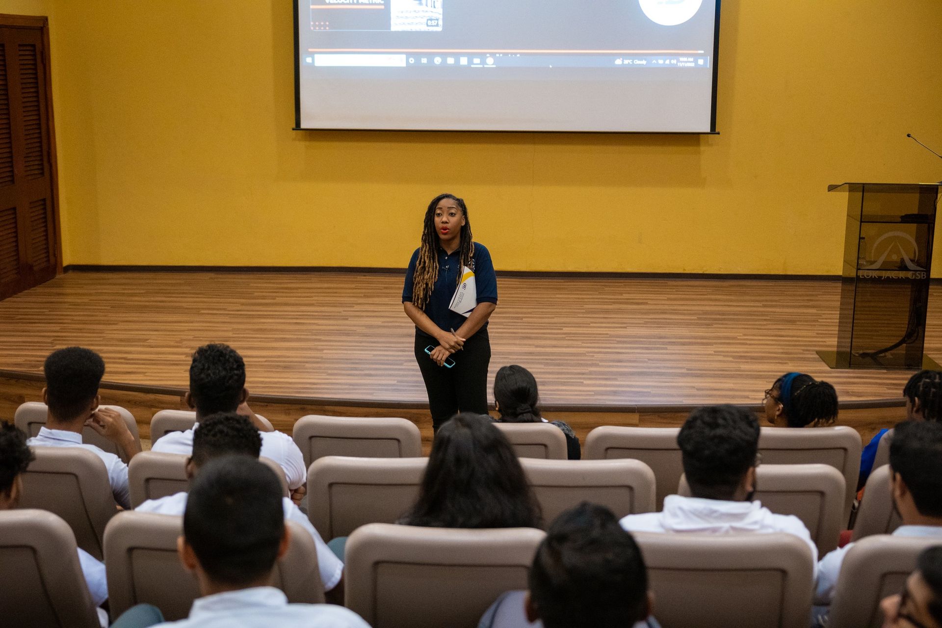 A member of staff presenting to visiting students