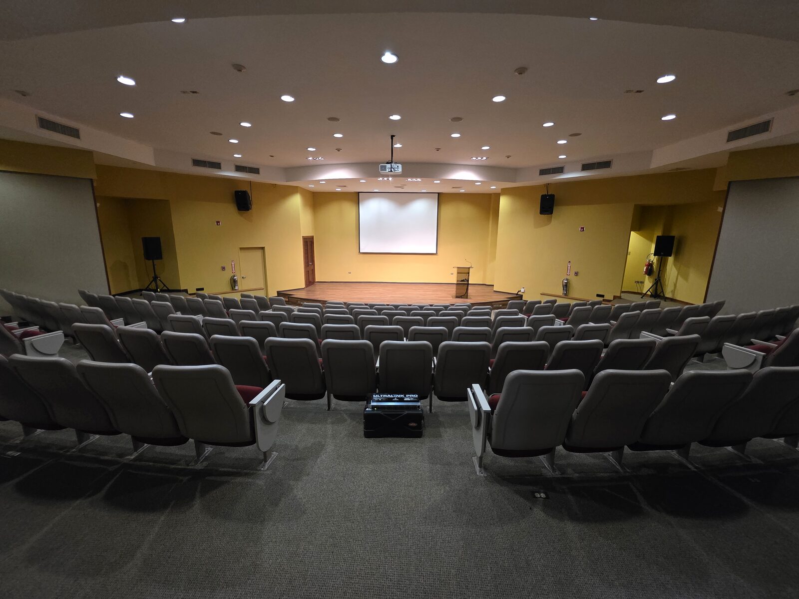 Yara Auditorium - raked theatre seating facing the stage and projection screen