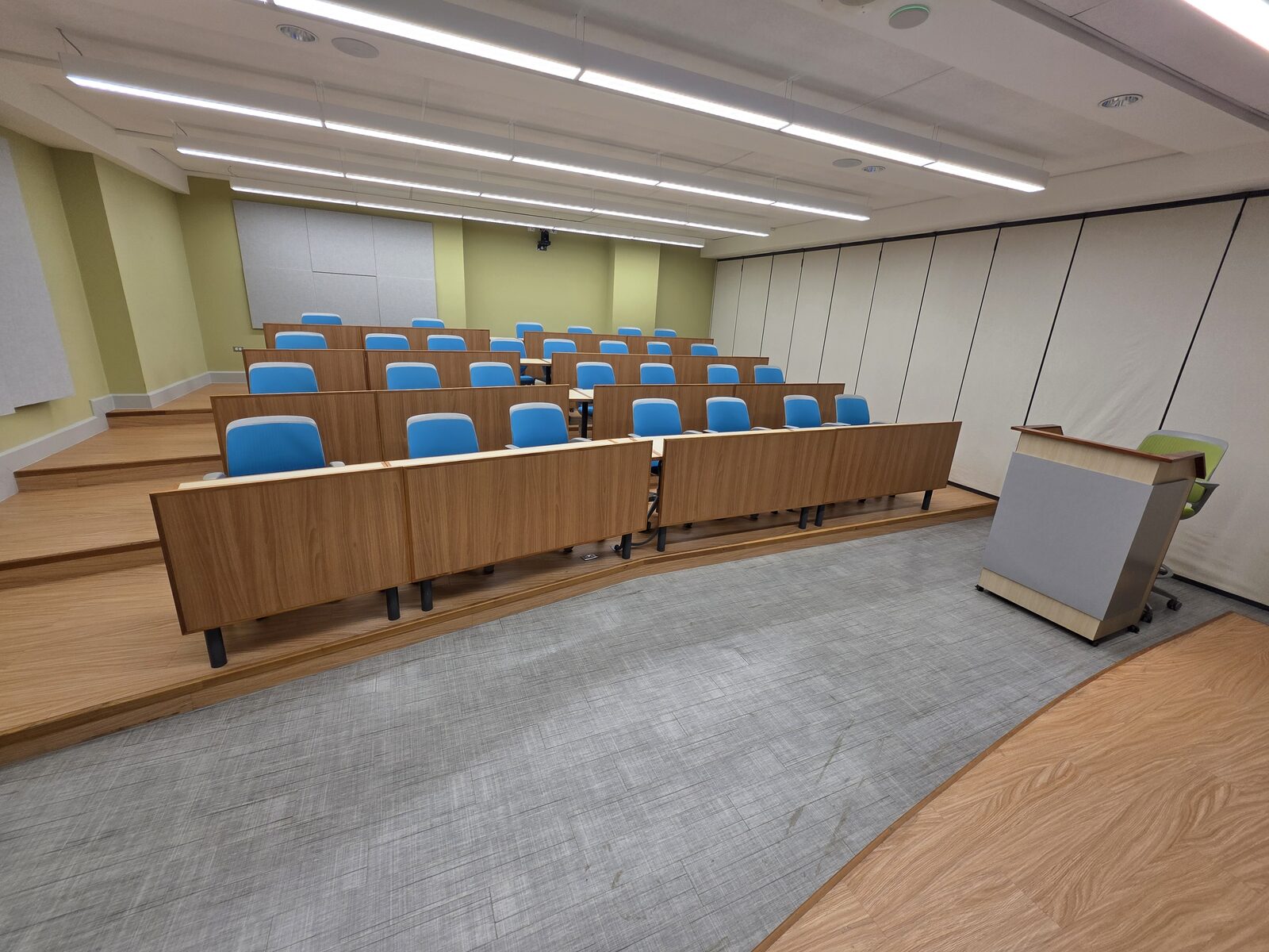 Lecture Room 1 - blue tiered seating above the teaching floor