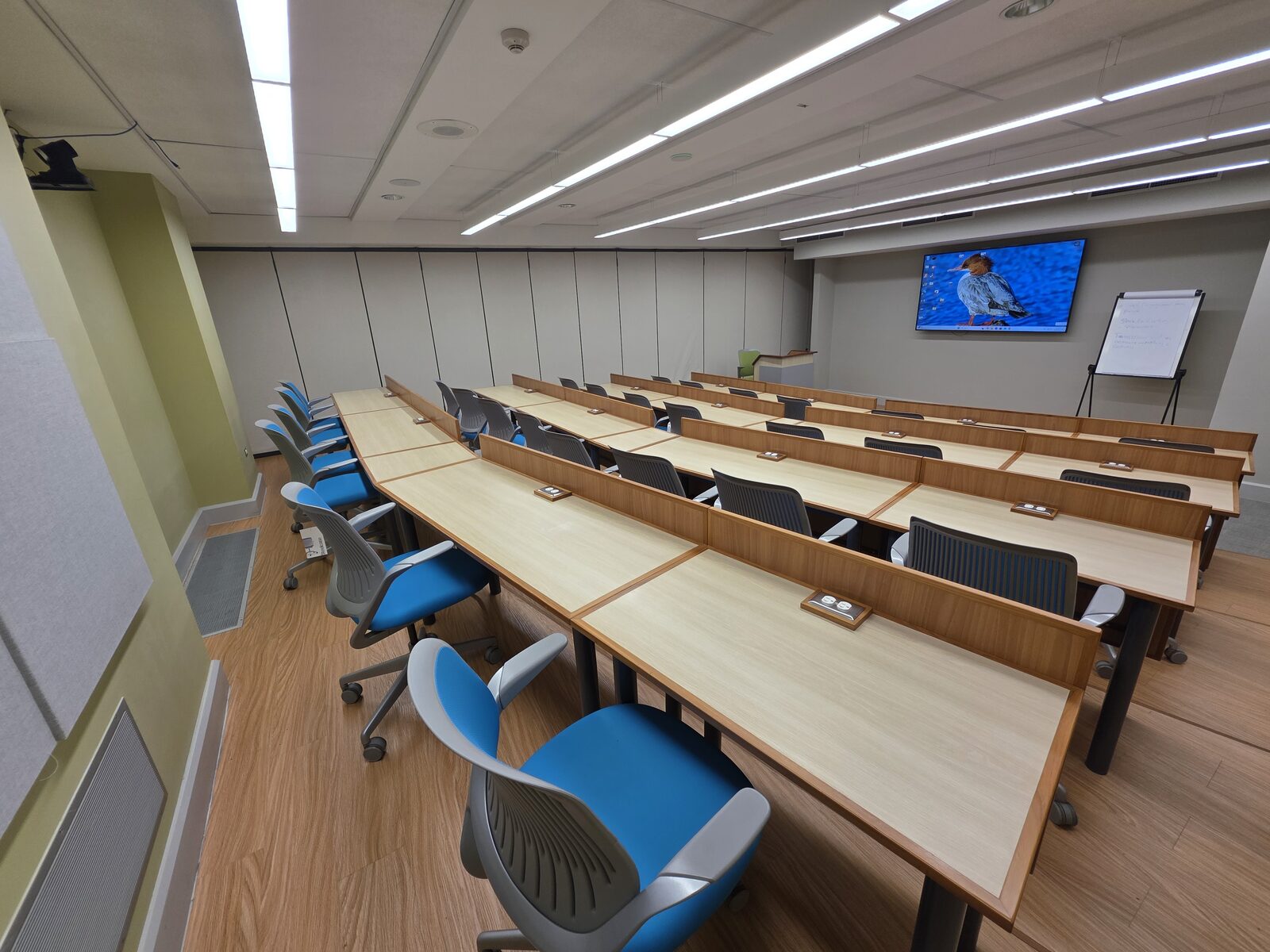 Lecture Room 1 - the room from the rear, facing the screen and flip chart