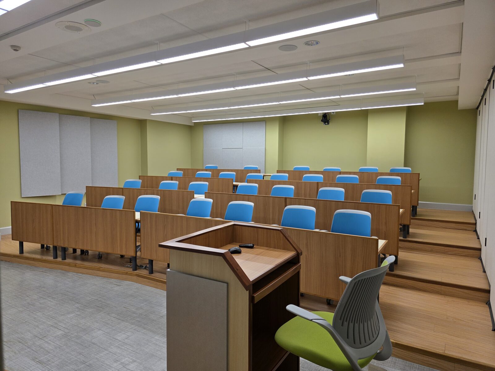 Lecture Room 1 - the lectern and tiered seating from the teaching floor